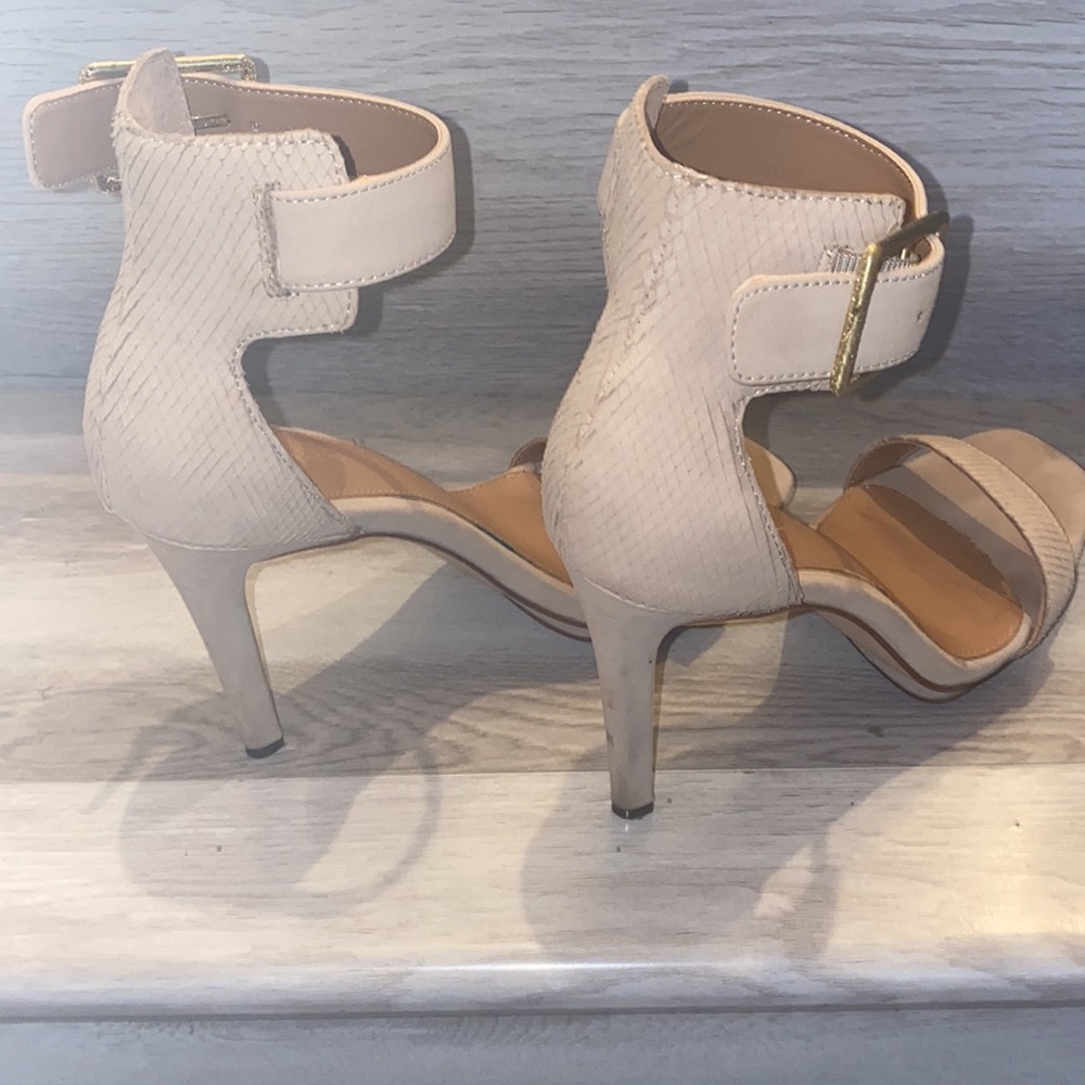 Nude Calvin Klein heels with gold buckles